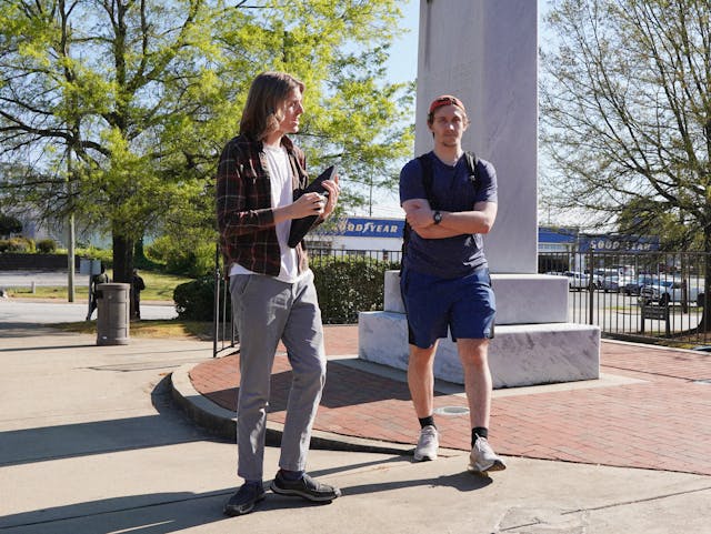 Picture of two Carolina Hacks high schoolers walking and talking